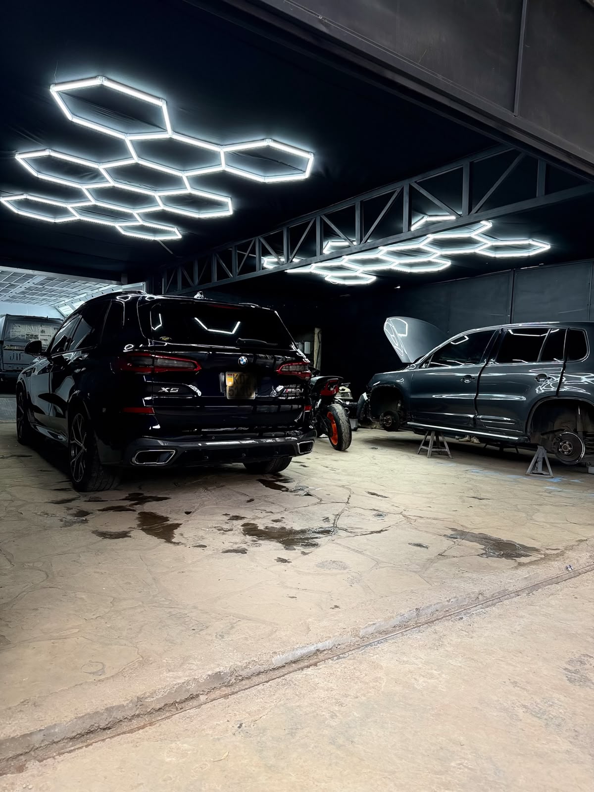 Car being professionally resprayed in a climate-controlled spray booth at DOP Autopaint & Detailing